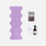 Tapis de sol pour le yoga de la marque hercule studio modèle mar couleur lavande et sangle de transport pour tapis de sport et spray parfumé énergisant pour tapis de sport packshot global