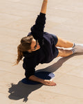 Yoga session with the Hercule Studio Galé navy comfort pad, elegant design for knees and elbows, durable mini mat made in France