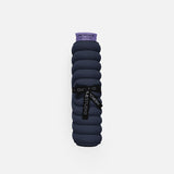 Hercule Studio Galé pad – navy blue portable 3-in-1 mini mat – convenient for transport and travel, suitable for Pilates/Reformer, durable French design, rolled view with logo ribbon