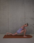 Gym class with Hercule Studio Archy terracotta sport mat, durable mat for yoga and floor exercises, elegant fitness atmosphere