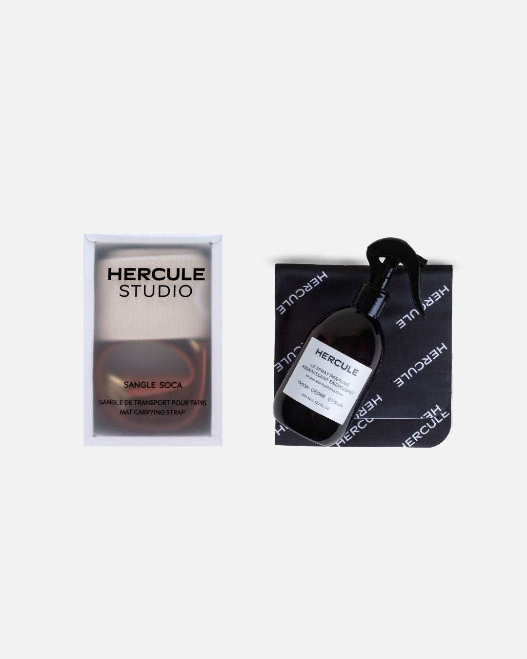 Sangle de transport dans sa boite de rangement et spray parfumé avec son tissu microfibre de la marque Hercule Studio photo packshot fond blanc
