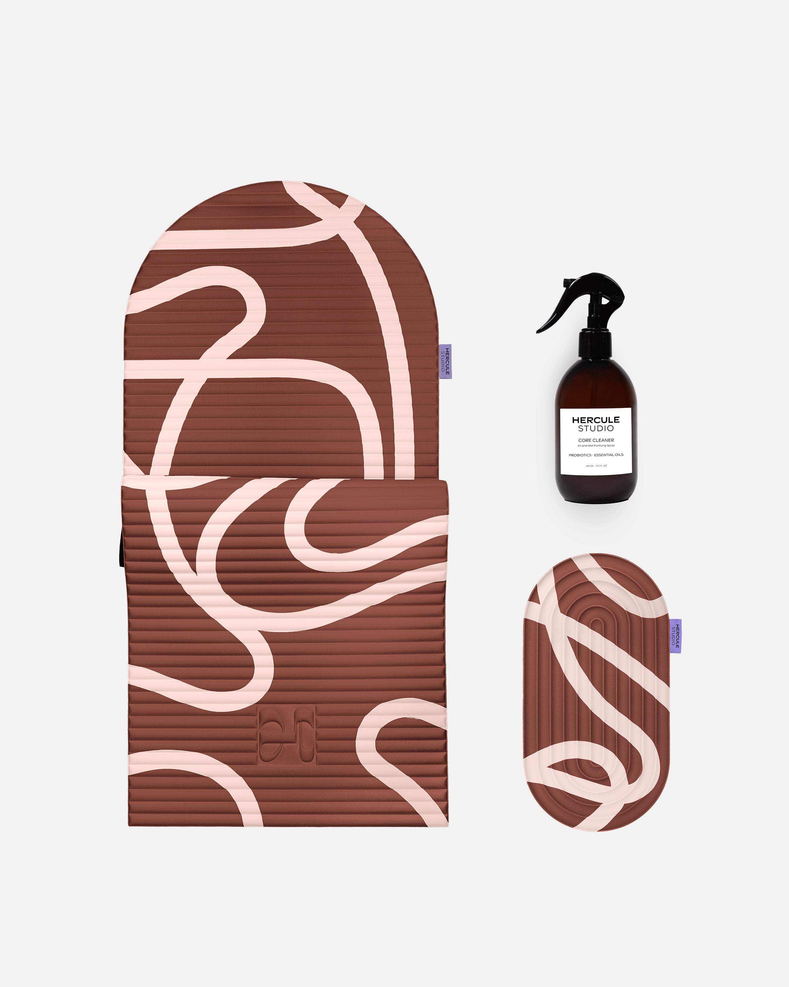 Hercule Studio Bari Choco printed essential bundle with the brown graphic Archy mat, the Galé 3-in-1 comfort pad and the sport mat sanitizing spray, durable made in France Pilates and fitness bundle, packshot