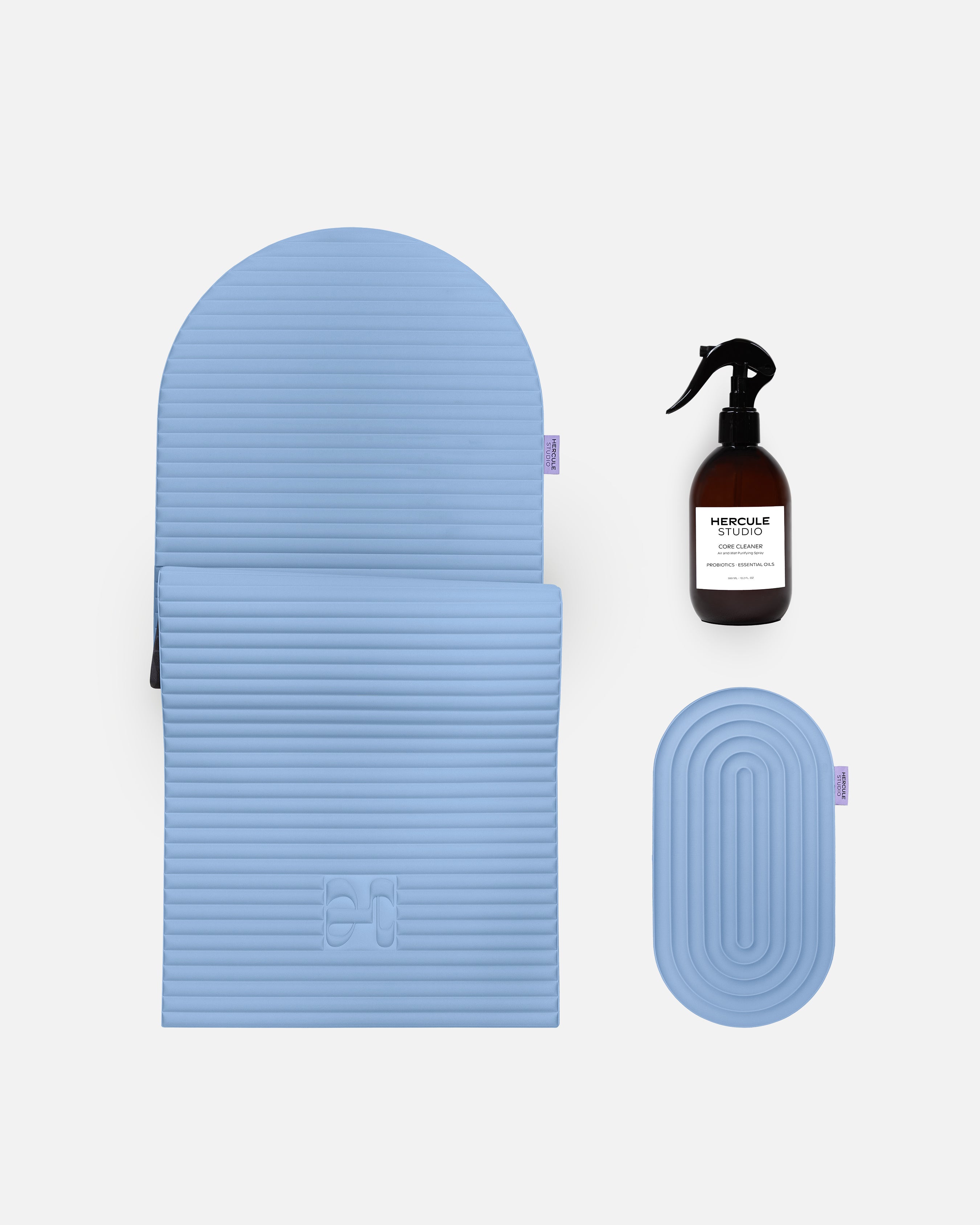 Hercule Studio blue jean essential bundle with the design Archy sport mat, the Galé 3-in-1 pad for sensitive areas and the sport mat cleaning spray, durable Made in France Pilates and fitness bundle, packshot image