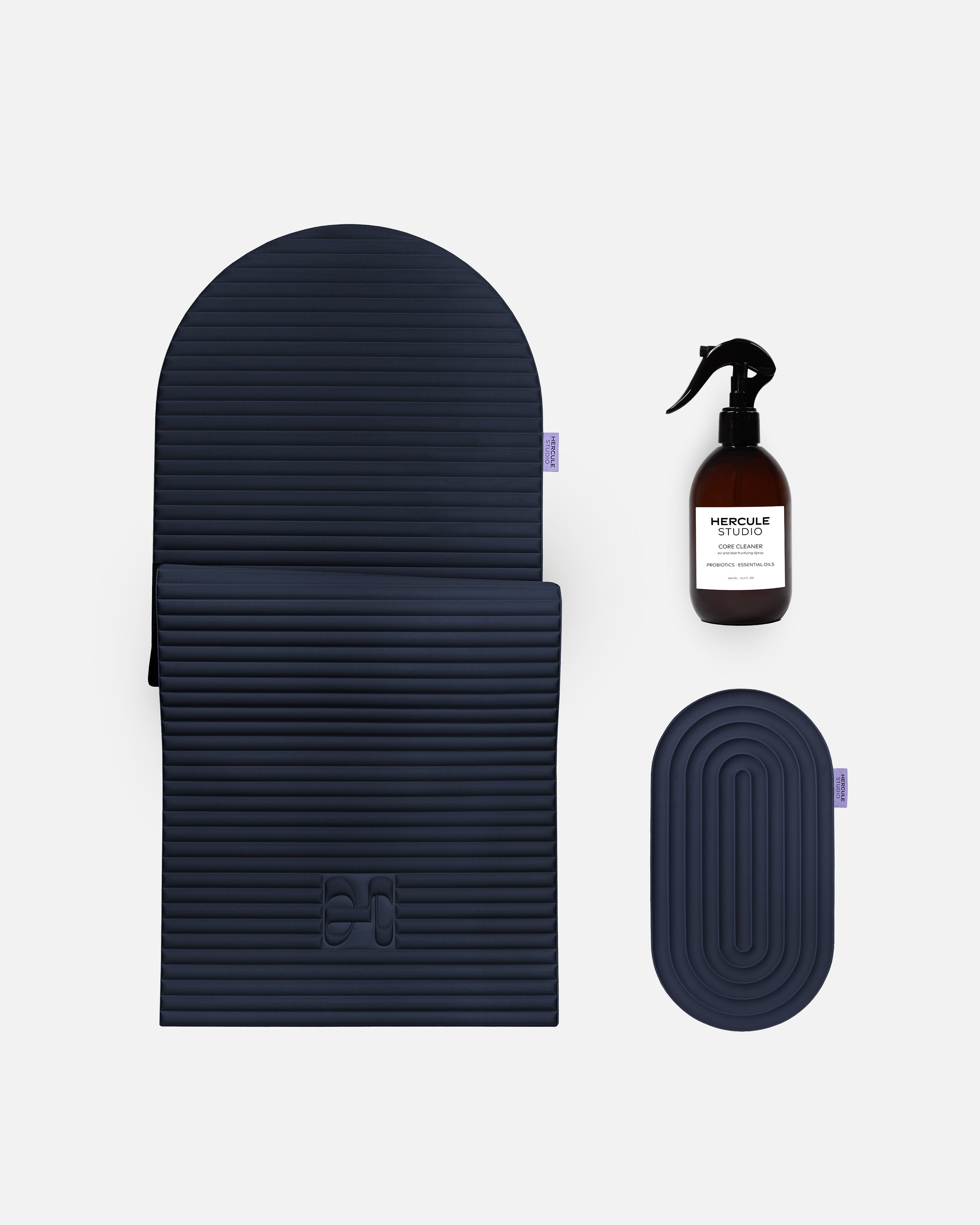 Hercule Studio navy blue essential bundle including the ergonomic Archy mat, the Galé comfort mini mat and the sport mat sanitizing spray, premium Pilates and fitness pack made in France, packshot visual