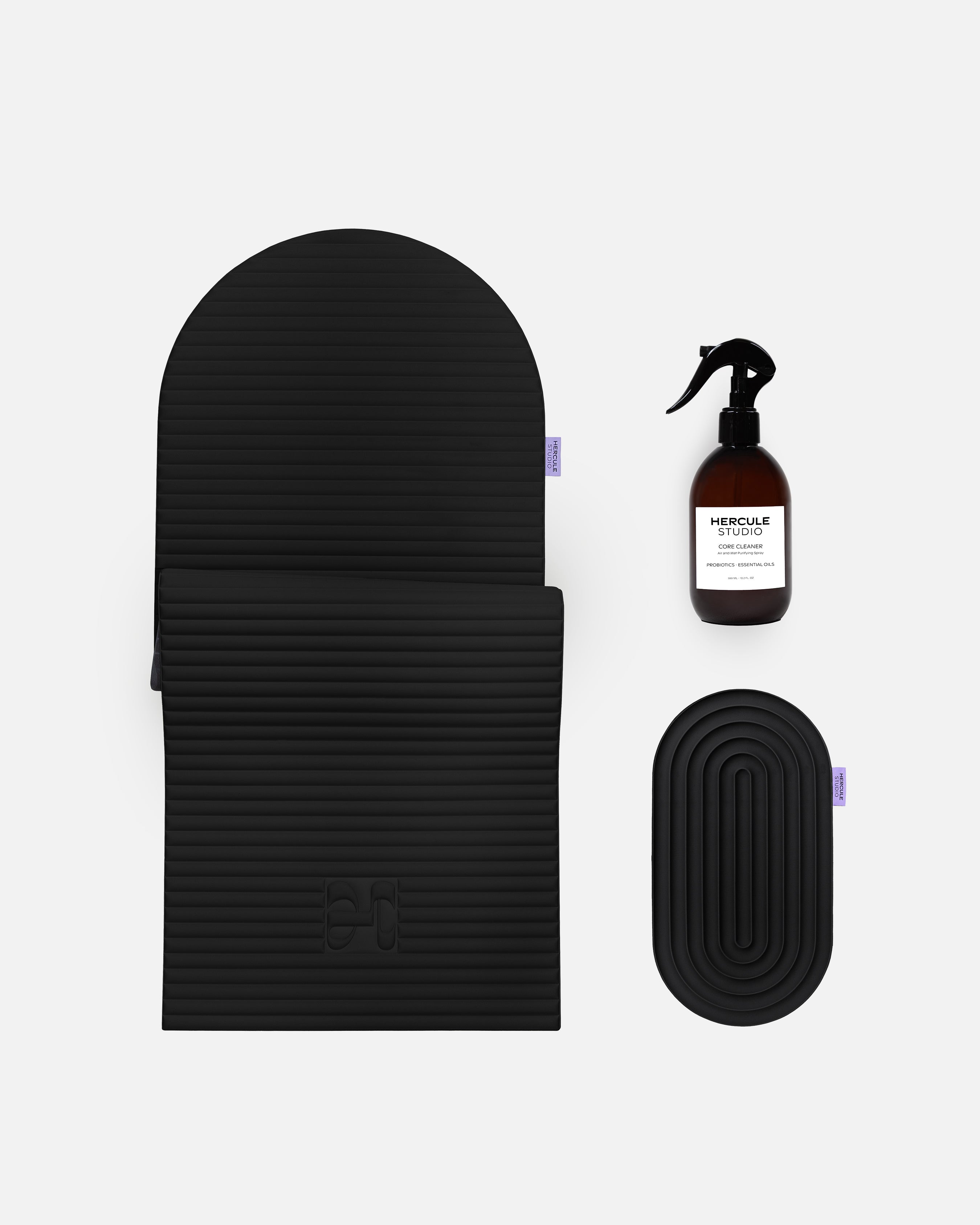 Hercule Studio Midnight Black essential sport bundle bringing together the premium Archy mat, the ergonomic Galé comfort pad and the sanitizing spray for yoga and fitness mats, complete Pilates Reformer solution Made in France, packshot view