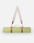 Hercule Studio pistachio green nomad bundle including the ergonomic Archy mat and a mat carrying strap for sport mats, lightweight and functional bundle for Pilates and fitness, French craftsmanship, packshot visual