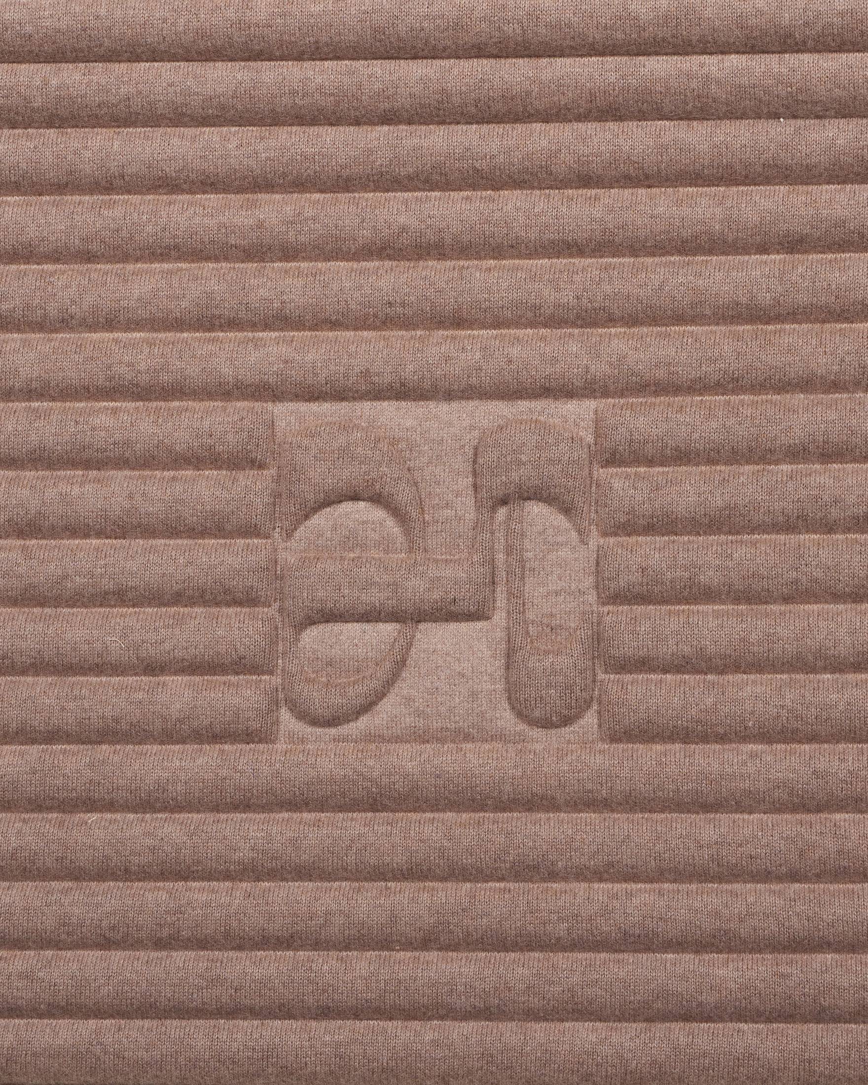 Close-up on the beige cashmere texture and embossed H logo of the Hercule Studio x From Future Sandy Brown sport mat