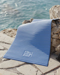 Hercule Studio Archy blue jean sport mat in lifestyle setting, vibrant blue tone for Pilates and gym classes, durable French design
