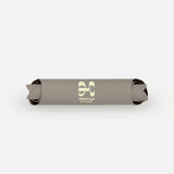 Packshot of the rolled Hercule Studio Greige mat, durable natural material, strong non-slip grip, modern wavy design