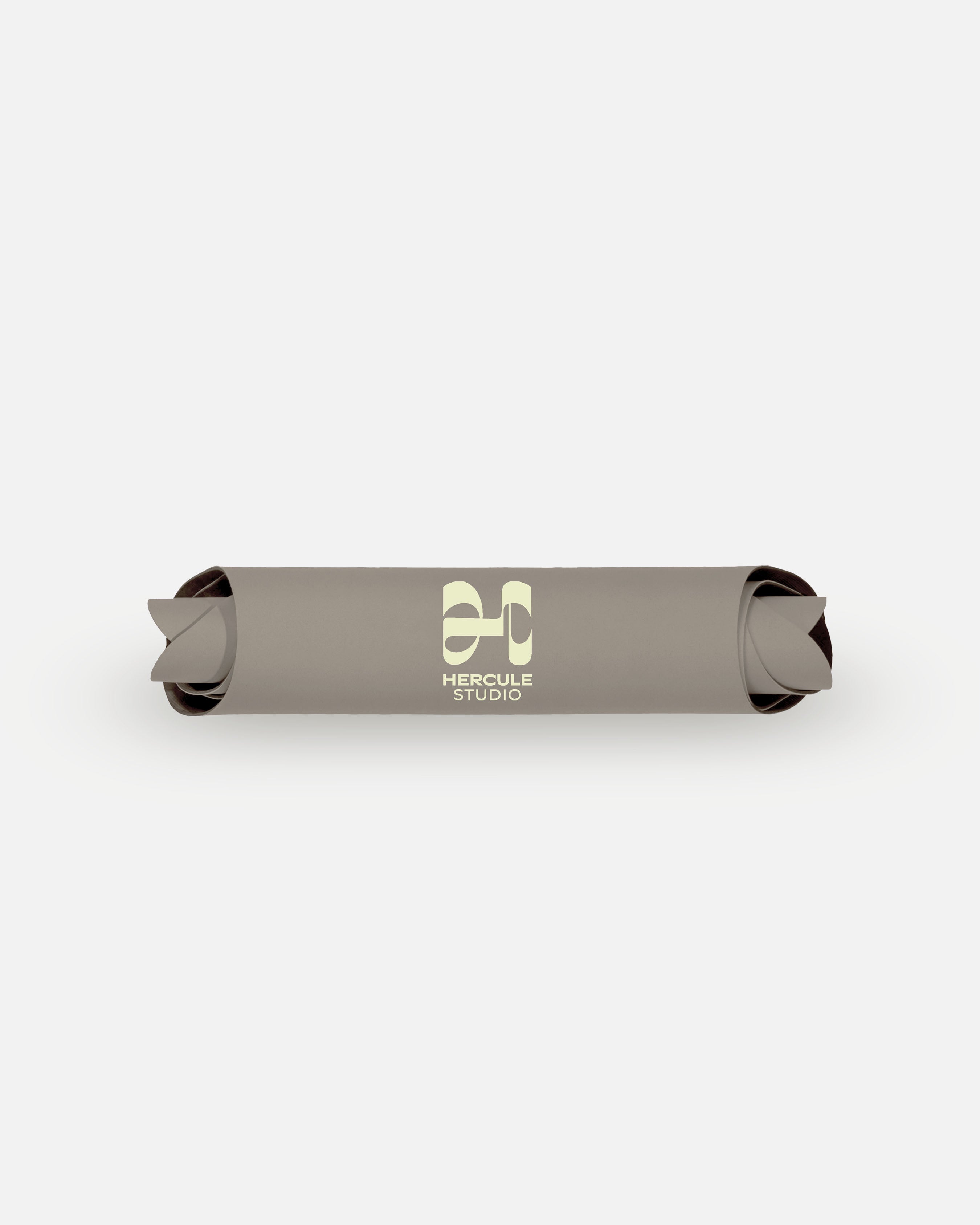 Packshot of the rolled Hercule Studio Greige mat, durable natural material, strong non-slip grip, modern wavy design