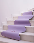 Hercule Studio Mar Lavender Yoga Mat in a lifestyle setting, featuring a soft purple hue perfect for yoga and meditation sessions, made from PVC-free natural rubber