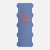 Hercule Studio Thomas Lélu quote yoga mat unrolled, blue background with red message, machine-washable suede, limited edition