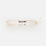 Hercule Studio x Thomas Lélu white fabric dust bag, protective cover with black logo for transport and storage of the Mar yoga mat
