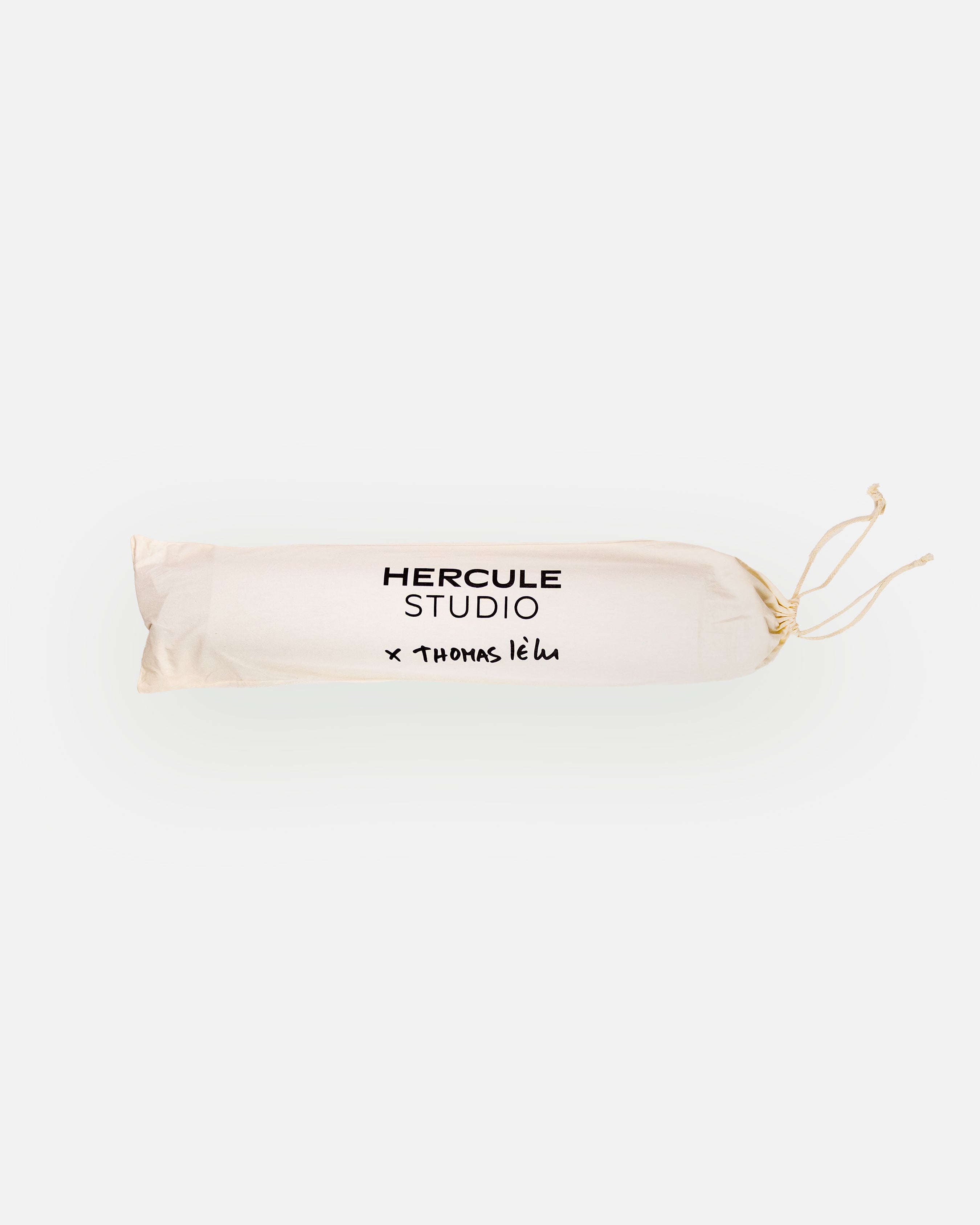Hercule Studio x Thomas Lélu white fabric dust bag, protective cover with black logo for transport and storage of the Mar yoga mat
