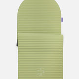 Hercule Studio Archy pistachio green arch-shaped sport mat, durable Made in France design mat for fitness, Pilates and stretching, half unrolled view