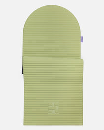 Hercule Studio Archy pistachio green arch-shaped sport mat, durable Made in France design mat for fitness, Pilates and stretching, half unrolled view