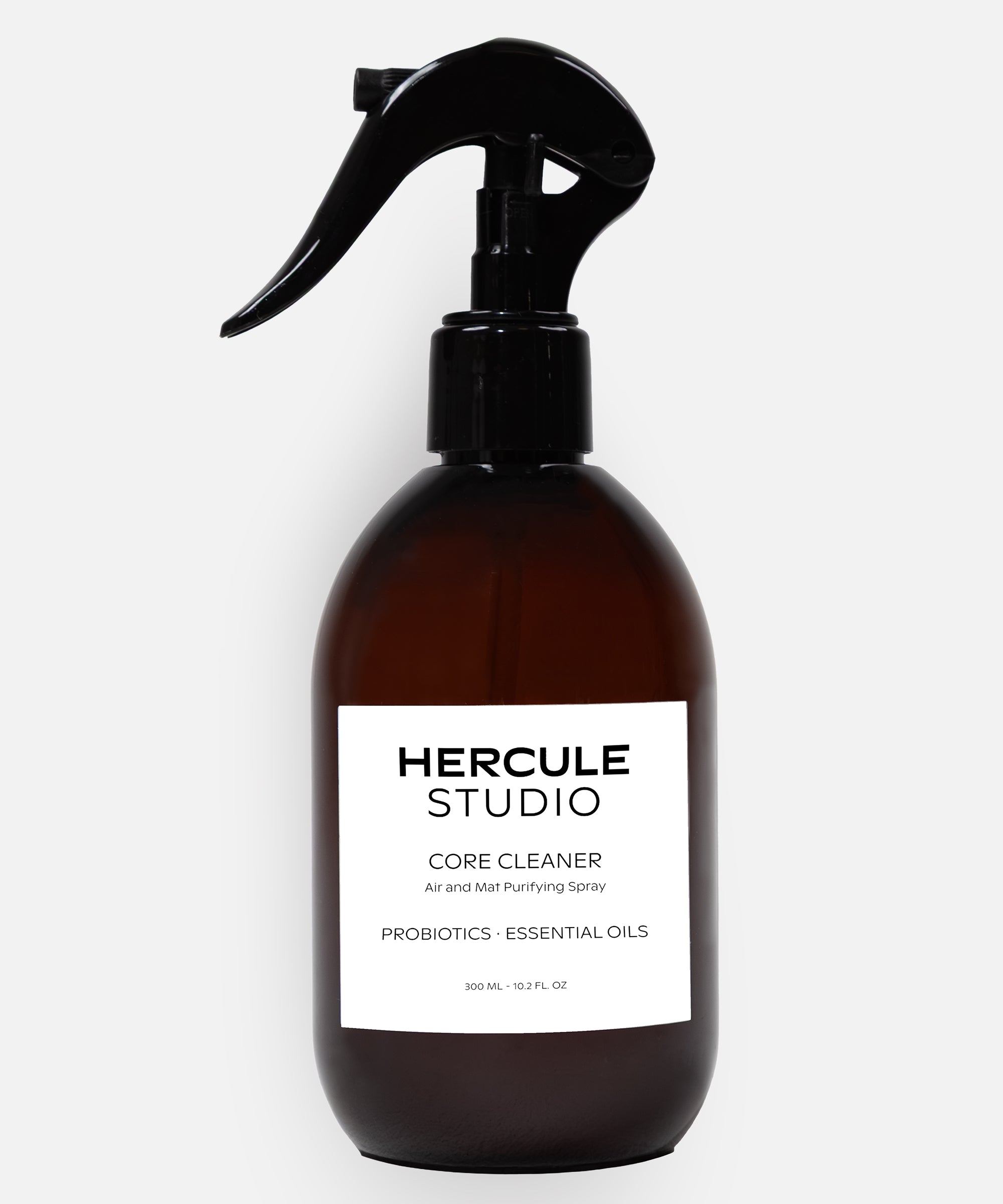 Hercule Studio Probiotic-Enriched Sanitizing Spray for Exercise Mats, a stylish 2-in-1 bottle designed to clean yoga and fitness mats and create an energizing atmosphere, made in France