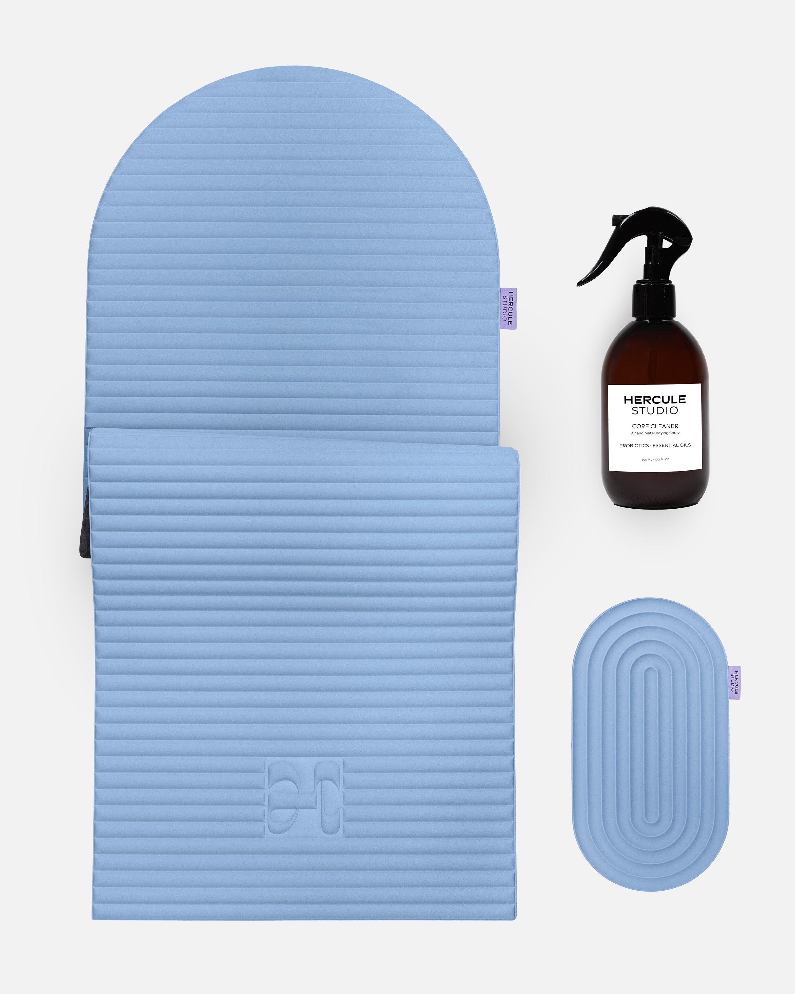 Hercule Studio blue jean essential bundle with the design Archy sport mat, the Galé 3-in-1 pad for sensitive areas and the sport mat cleaning spray, durable Made in France Pilates and fitness bundle, packshot image